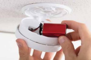 Putting batteries in a smoke detector